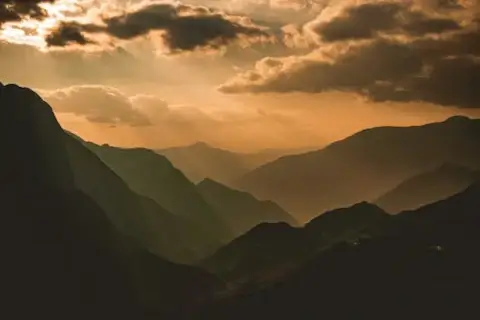 View of distant mountains and valleys scenery bathed in hazy sunlight